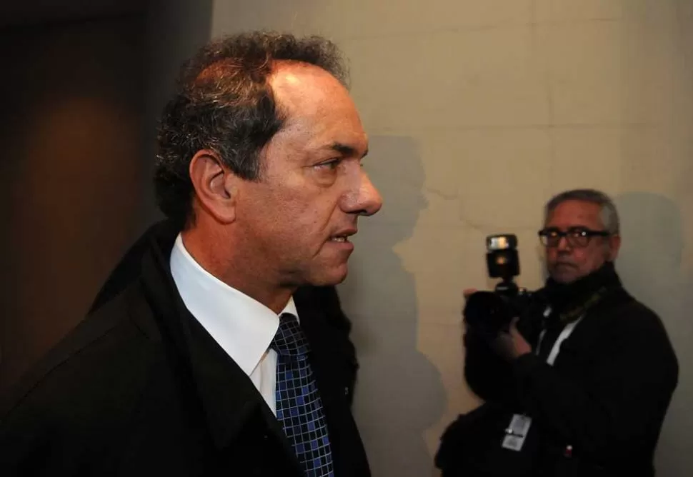 PAÑOS FRIOS. Scioli tuvo un tono muy conciliador, y salió a defender a la mandataria. DYN