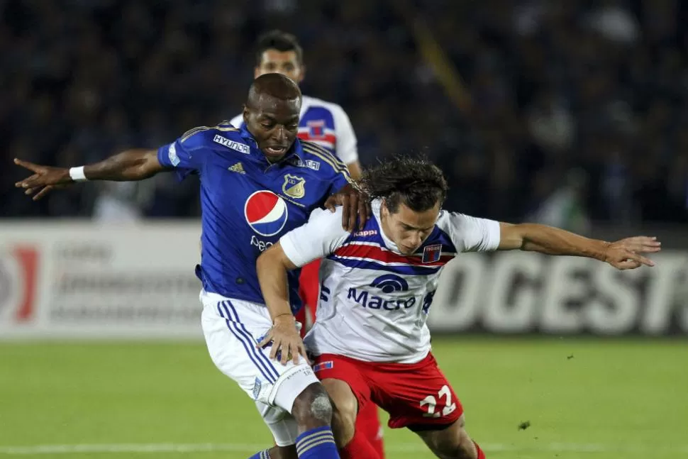 CON EL CORAZON. Tigre defendió cada pelota que jugó y el empate en Bogotá lo colocó en la final de la Copa Sudamericana. REUTERS