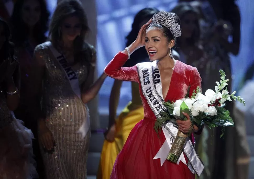 NUEVA SOBERANA. La violonchelista Olivia Culpo es la primera Miss Universo desde la elección de 1997. REUTERS