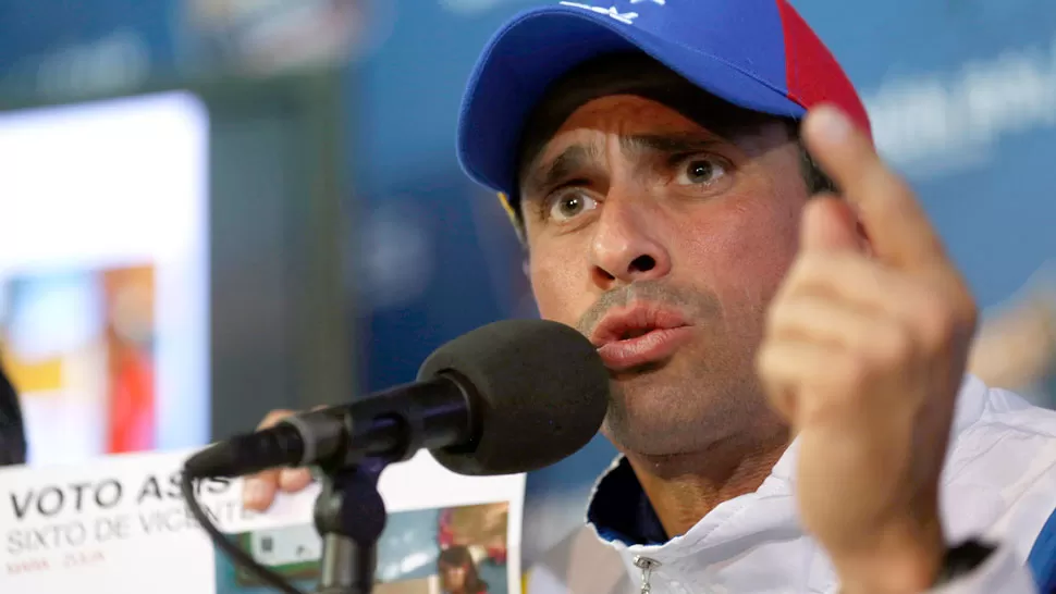 MARCHA ATRAS. Tras las muertes, Capriles canceló la manifestación de hoy. REUTERS