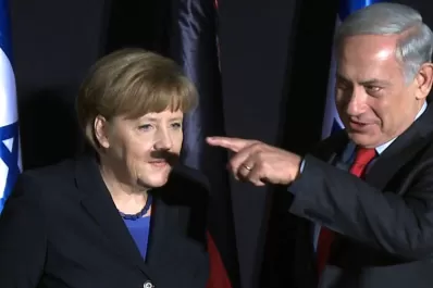 Furor por la foto de Merkel con una sombra como bigote