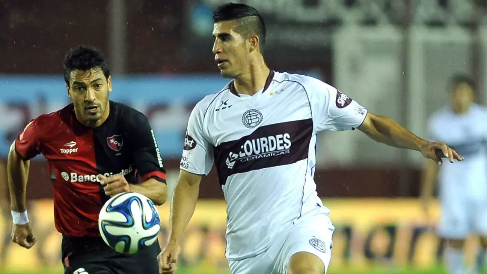 LUCHA PAREJA. Lanús y Newell's no se sacaron ventajas y empataron 1 a 1. TELAM