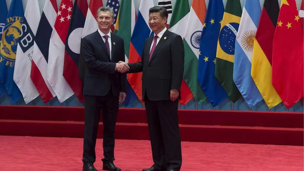 MACRI Y XI JINPING. El presidente chino elogió la administración de Mauricio Macri. DYN