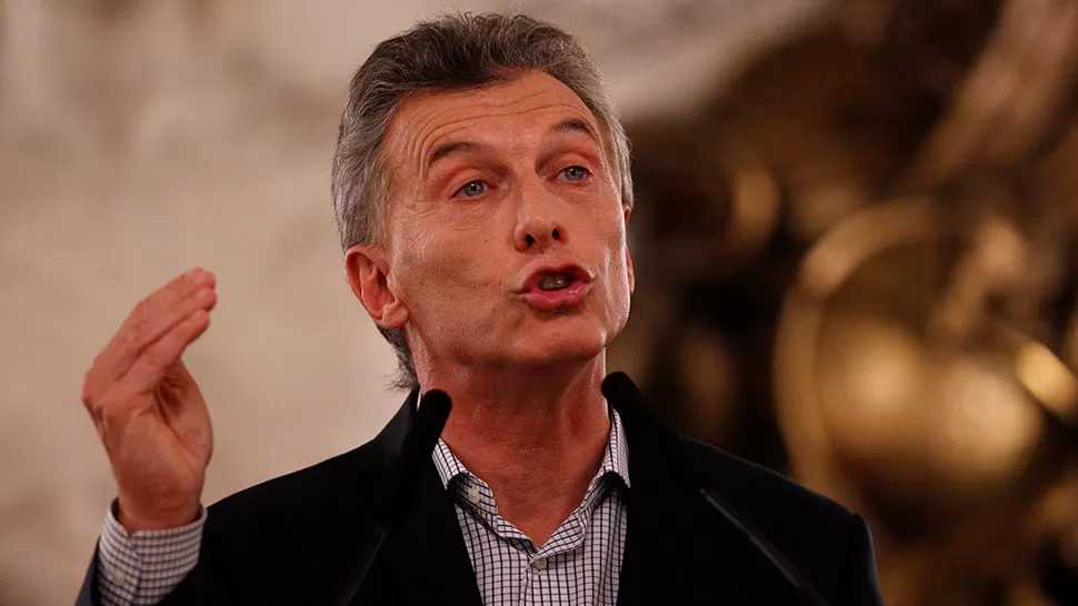 MAURICIO MACRI. El presidente, durante la conferencia de prensa en la que dio marcha atrás con el acuerdo del correo y el aumento de las jubilaciones. DYN