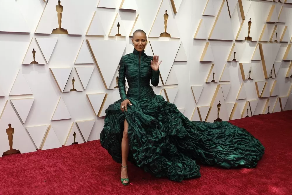 PROTAGONISTAS. Arriba: Jada Pinkett. Abajo: Rock, Smith y la cachetada. reuters