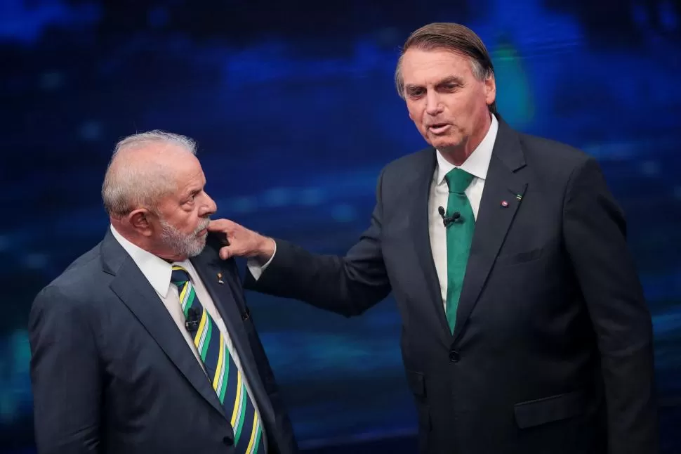 ENFRENTAMIENTO. Lula y Bolsonaro durante los debates. 